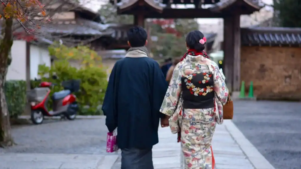 Traditional festivals in Japan experienced by locals wearing kimono and haori while walking toward a shrine.