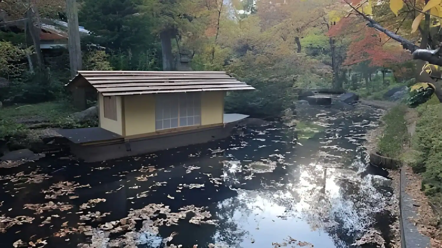 A tranquil pond and teahouse inside the Nezu Museum Garden, one of Tokyo’s hidden gems