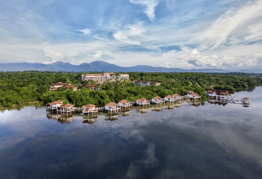 Different units of the resort lined up near the sea.