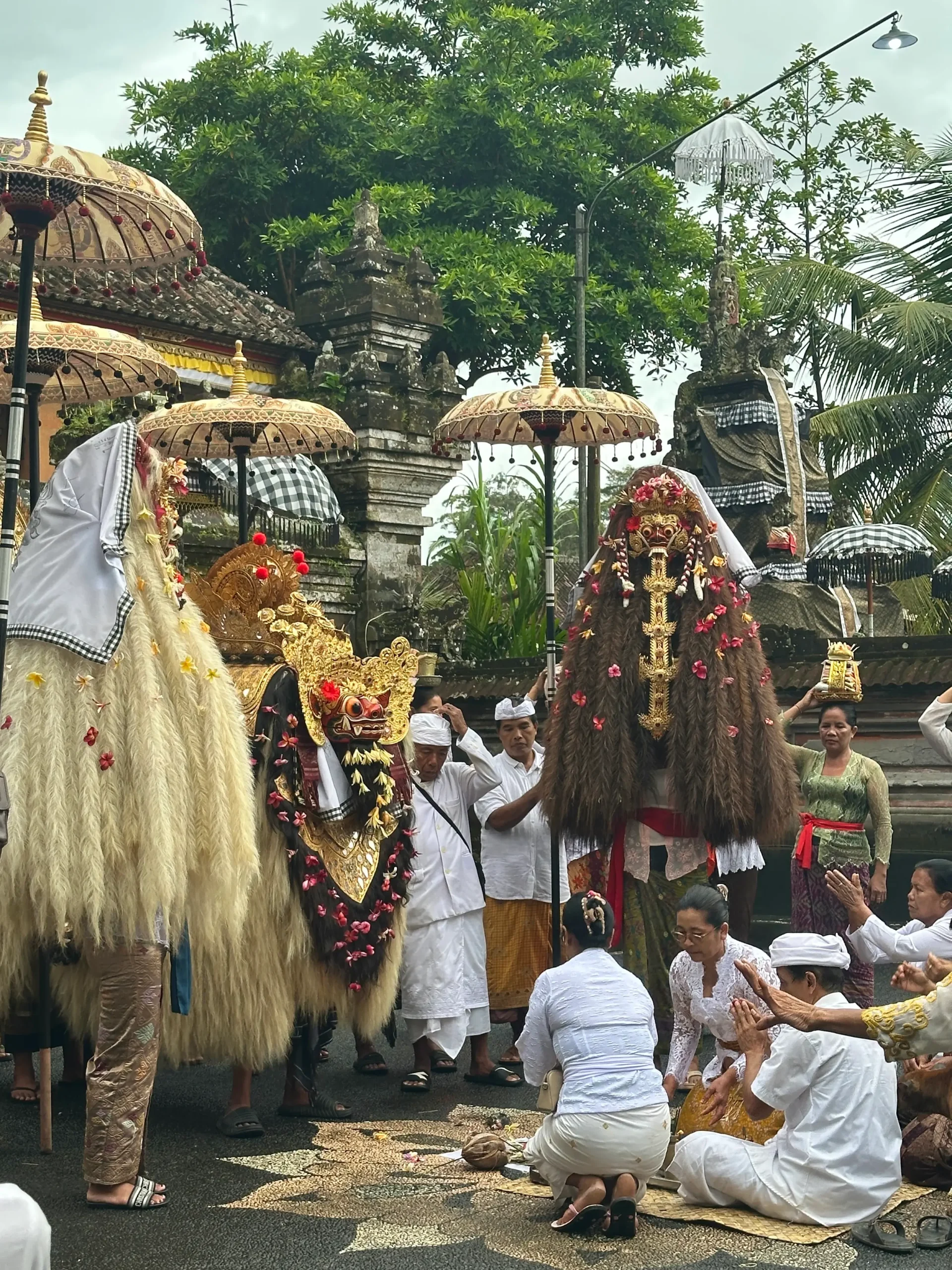Traditional Balinese ceremony with Barong dancers at a temple, showing one of the most cultural things to do in Ubud.