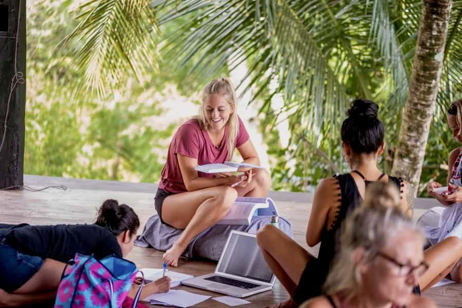 Zuna Yoga students studying curriculum during yoga teacher training in Bali open-air shala
