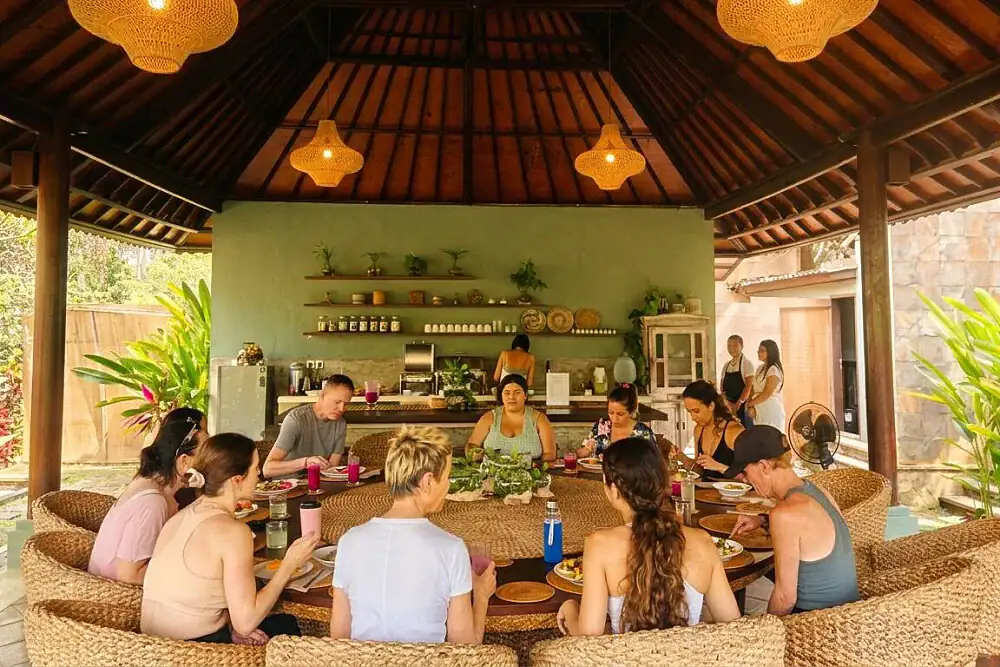 Group sitting in a circle in a bamboo pavilion during the neurogenic reset retreat in Ubud